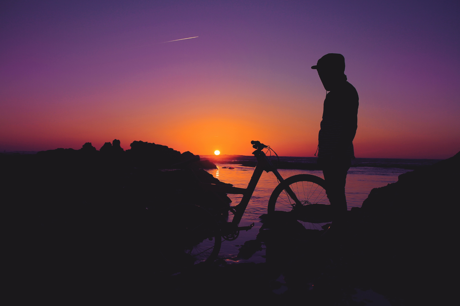 Admiring the sunset with a bicycle.