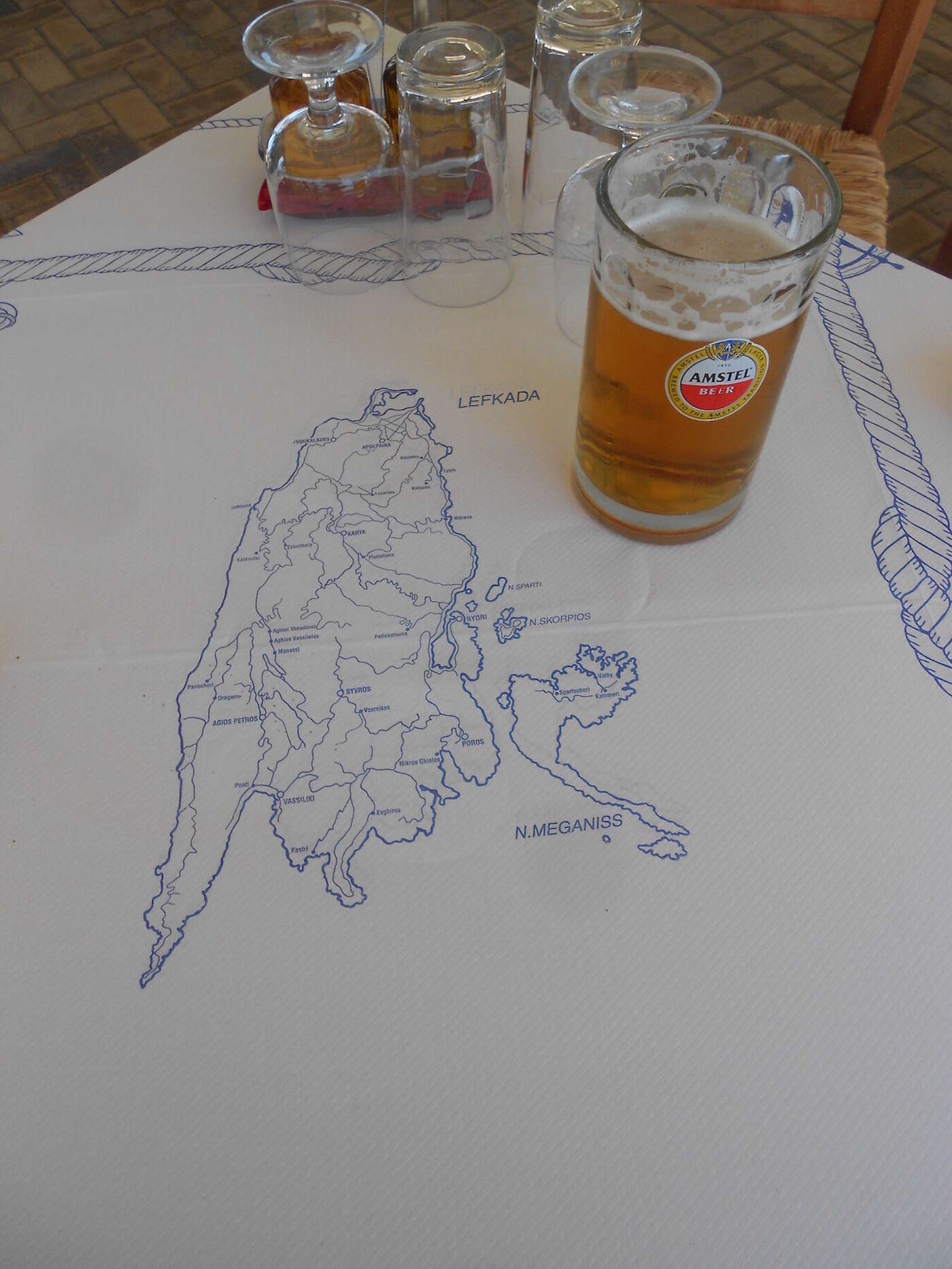 Lefkas map tablecloth, with a beer