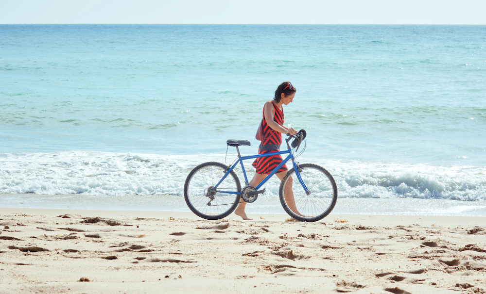 Taking a bike along the beach.