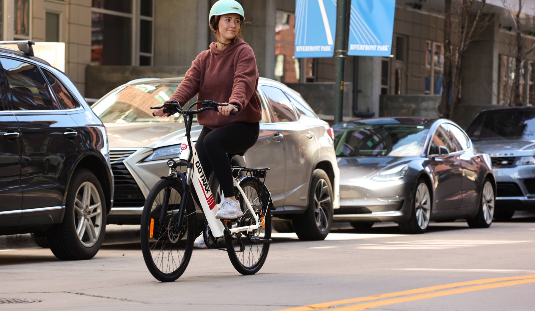 Riding an e-bike through the city.